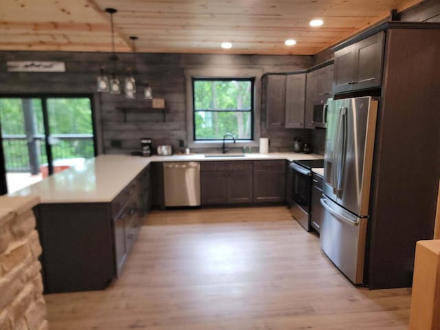 18358 Buckingham Rd, Logan, OH 43138 - kitchen featuring stainless steel appliances, wooden ceiling, a peninsula, light wood finished floors, and light countertops