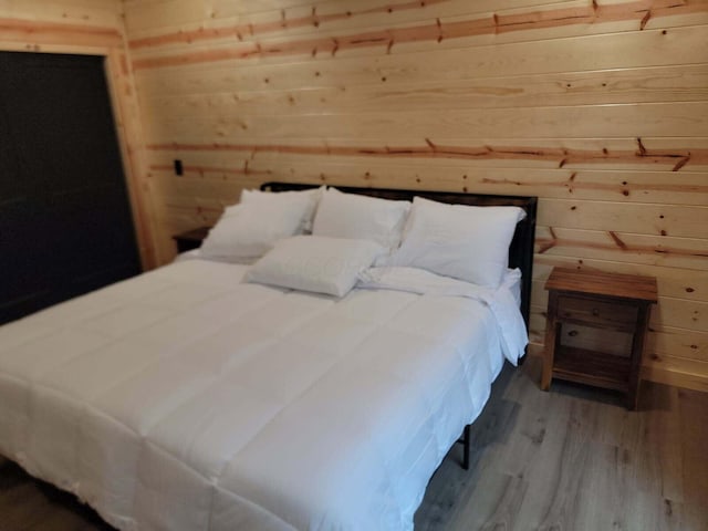 18358 Buckingham Rd, Logan, OH 43138 - bedroom featuring wood walls and wood finished floors