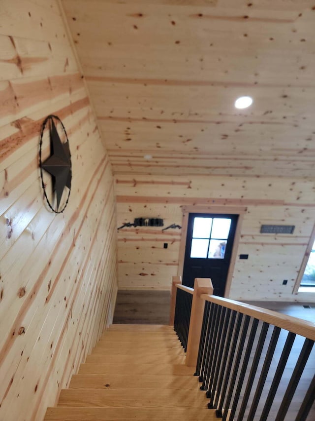18358 Buckingham Rd, Logan, OH 43138 - stairs with wood walls, healthy amount of natural light, and wood finished floors