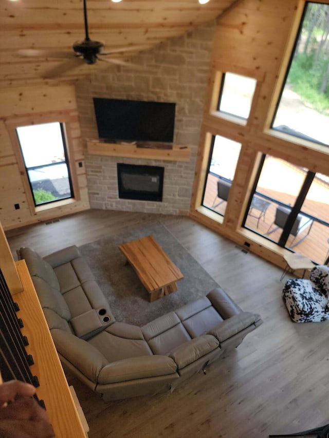 18358 Buckingham Rd, Logan, OH 43138 - living room featuring wood finished floors, high vaulted ceiling, a fireplace, and ceiling fan