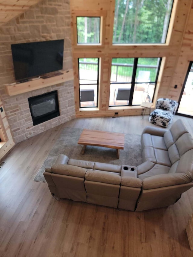 18358 Buckingham Rd, Logan, OH 43138 - living area with a fireplace, wood finished floors, and plenty of natural light