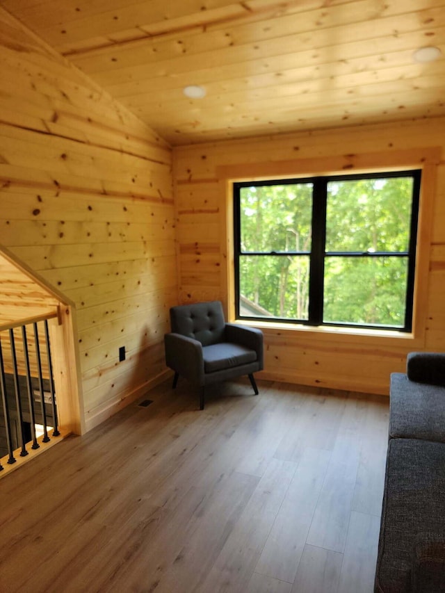 18358 Buckingham Rd, Logan, OH 43138 - living area featuring wood finished floors, wooden walls, vaulted ceiling, and wooden ceiling