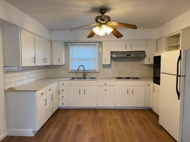 139 S Ashburton Rd, Columbus, OH 43213 - kitchen featuring freestanding refrigerator, under cabinet range hood, a ceiling fan, oven, and wood finished floors