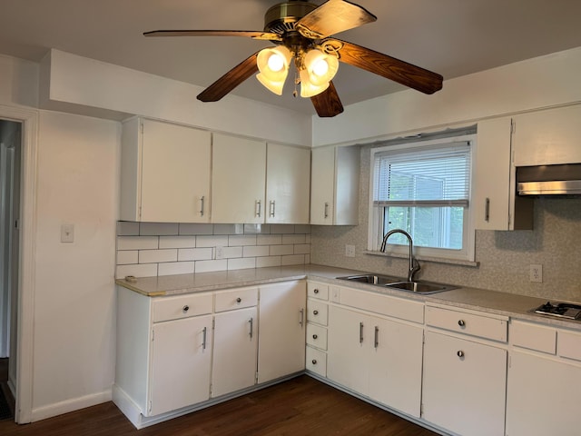 139 S Ashburton Rd, Columbus, OH 43213 - kitchen featuring ventilation hood, tasteful backsplash, dark wood finished floors, and light countertops