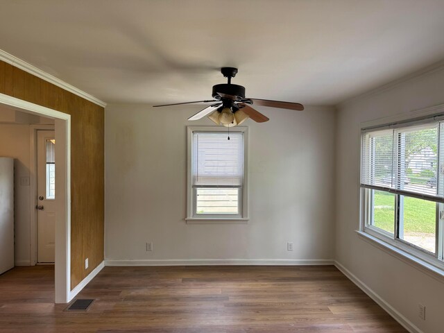139 S Ashburton Rd, Columbus, OH 43213 - unfurnished room featuring dark wood-type flooring, a ceiling fan, and crown molding