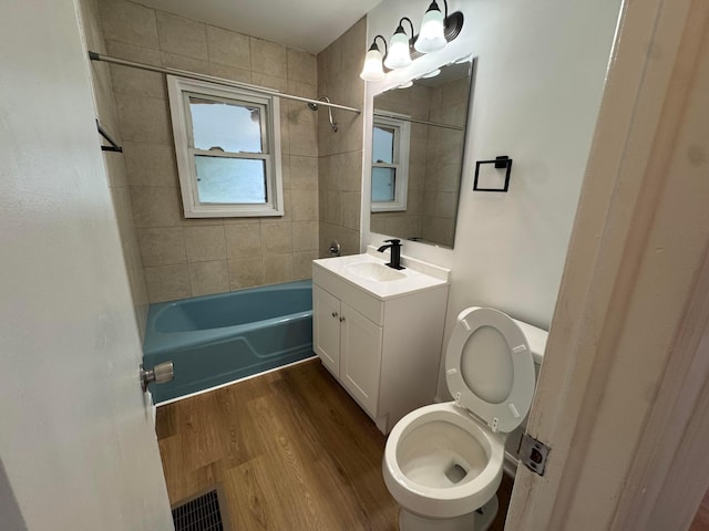 139 S Ashburton Rd, Columbus, OH 43213 - full bathroom featuring vanity, wood finished floors, and washtub / shower combination