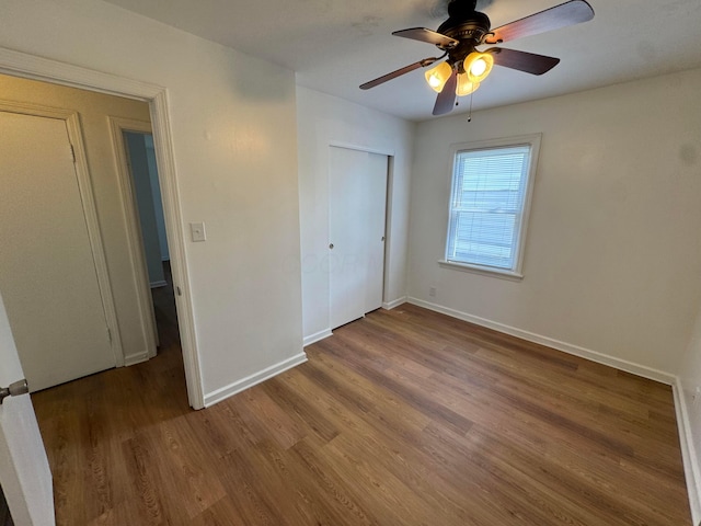 139 S Ashburton Rd, Columbus, OH 43213 - unfurnished bedroom featuring wood finished floors, a closet, and ceiling fan
