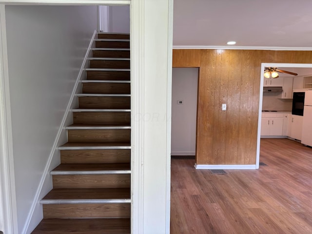 139 S Ashburton Rd, Columbus, OH 43213 - staircase featuring ceiling fan, wood finished floors, recessed lighting, and wood walls
