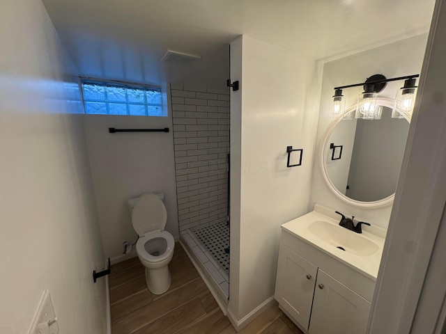 139 S Ashburton Rd, Columbus, OH 43213 - bathroom with a shower stall, vanity, and wood finished floors