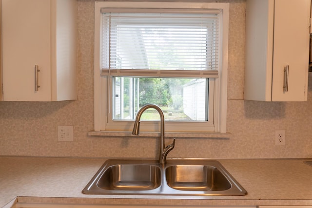 139 S Ashburton Rd, Columbus, OH 43213 - kitchen featuring light countertops, decorative backsplash, and white cabinets