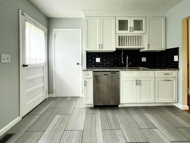 5200 Williamsburg Cir, Hilliard, OH 43026 - kitchen featuring dishwasher, tasteful backsplash, dark stone countertops, and white cabinetry