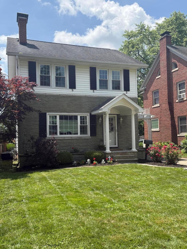 552 E 5th Ave, Lancaster, OH 43130 - view of front of home with a front yard and a chimney