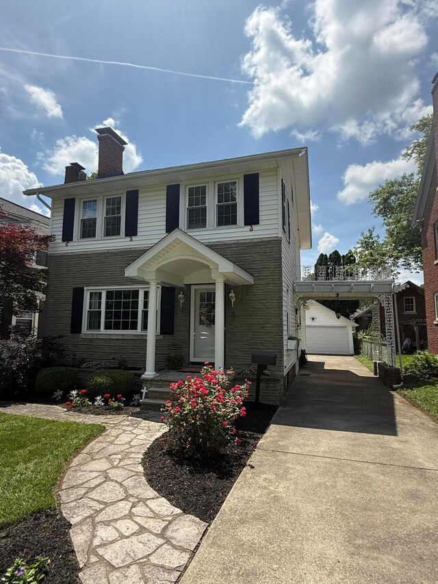552 E 5th Ave, Lancaster, OH 43130 - traditional home with an outbuilding, a chimney, driveway, and a garage