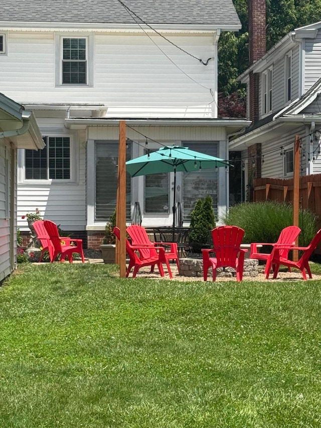 552 E 5th Ave, Lancaster, OH 43130 - back of property featuring roof with shingles and an outdoor fire pit