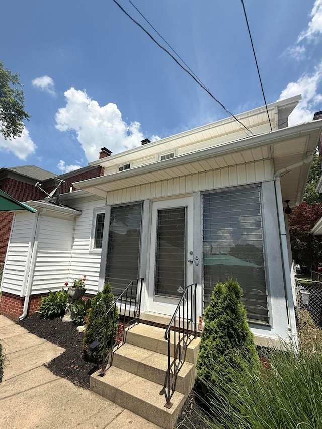 552 E 5th Ave, Lancaster, OH 43130 - view of front of home with entry steps and a chimney