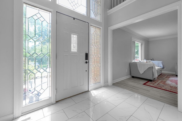 7732 Quarry Cliff Ct, Reynoldsburg, OH 43068 - foyer featuring crown molding and marble look tiles