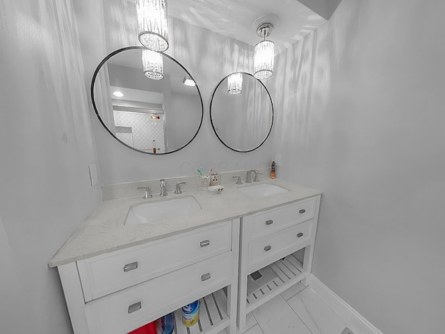 7732 Quarry Cliff Ct, Reynoldsburg, OH 43068 - bathroom featuring double vanity, marble finish flooring, and a chandelier