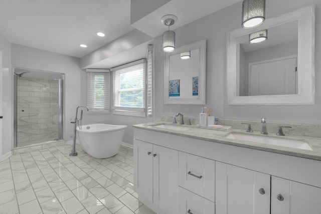7732 Quarry Cliff Ct, Reynoldsburg, OH 43068 - full bathroom with double vanity, a freestanding tub, and a stall shower