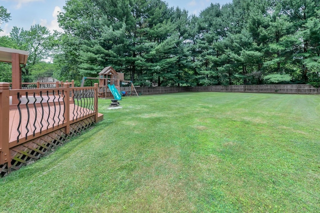7732 Quarry Cliff Ct, Reynoldsburg, OH 43068 - fenced backyard featuring a playground and a deck