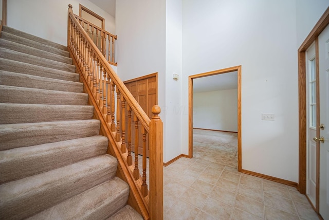 1948 Wendover Cir NE, North Canton, OH 44720 - stairway featuring a towering ceiling and tile patterned floors