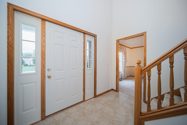 1948 Wendover Cir NE, North Canton, OH 44720 - entrance foyer with healthy amount of natural light, stairway, and light tile patterned floors