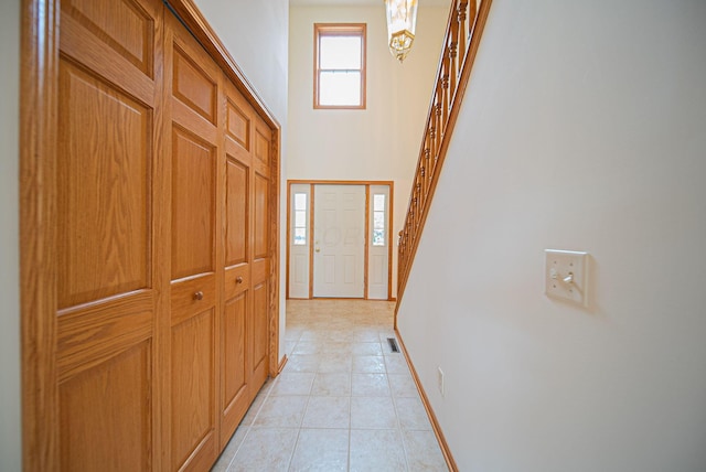 1948 Wendover Cir NE, North Canton, OH 44720 - entryway with stairway, light tile patterned flooring, and a high ceiling