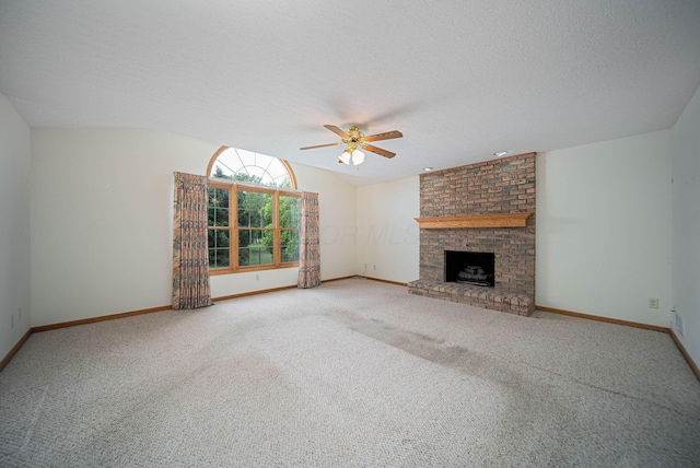 1948 Wendover Cir NE, North Canton, OH 44720 - unfurnished living room with a ceiling fan, carpet, a fireplace, and a textured ceiling