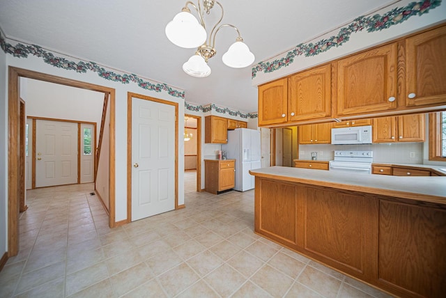 1948 Wendover Cir NE, North Canton, OH 44720 - kitchen featuring white appliances, a chandelier, a peninsula, brown cabinets, and light countertops