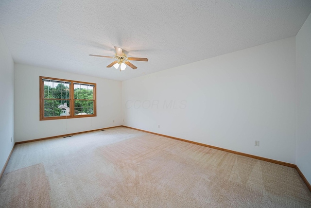 1948 Wendover Cir NE, North Canton, OH 44720 - carpeted spare room with ceiling fan and a textured ceiling