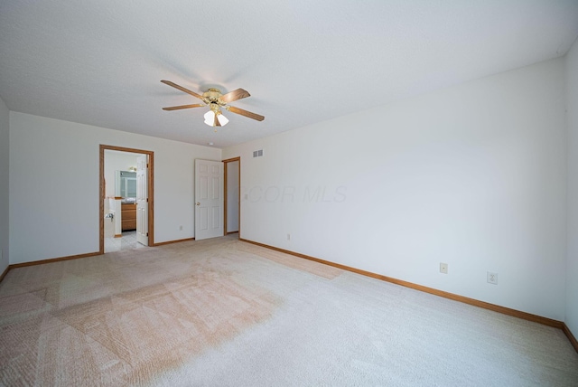 1948 Wendover Cir NE, North Canton, OH 44720 - unfurnished bedroom with light colored carpet, ensuite bath, and a ceiling fan