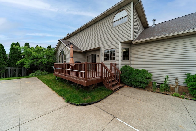1948 Wendover Cir NE, North Canton, OH 44720 - back of property featuring a patio area, a deck, and roof with shingles