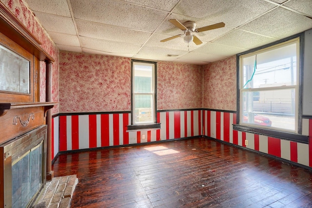 514 S Columbus St, Lancaster, OH 43130 - spare room with wallpapered walls, a paneled ceiling, hardwood / wood-style floors, wainscoting, and plenty of natural light