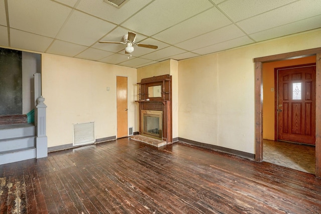 514 S Columbus St, Lancaster, OH 43130 - unfurnished living room with a paneled ceiling, ceiling fan, wood-type flooring, a fireplace, and stairway