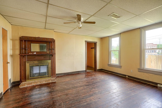 514 S Columbus St, Lancaster, OH 43130 - unfurnished living room featuring a drop ceiling, wood-type flooring, ceiling fan, and a glass covered fireplace