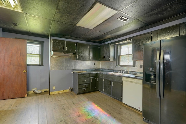 514 S Columbus St, Lancaster, OH 43130 - kitchen featuring refrigerator with ice dispenser, white dishwasher, under cabinet range hood, healthy amount of natural light, and a drop ceiling