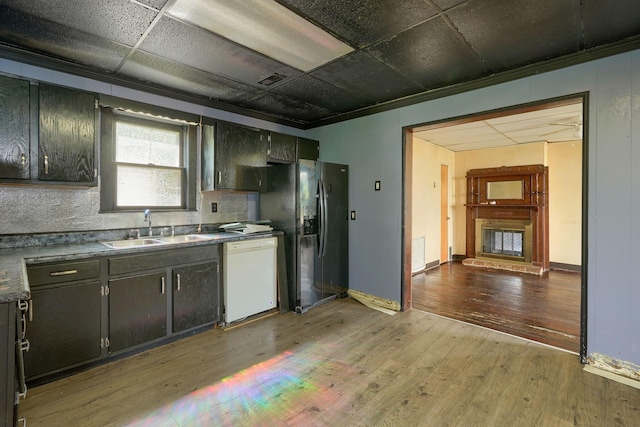 514 S Columbus St, Lancaster, OH 43130 - kitchen with dishwasher, black fridge, light wood-style flooring, and ornamental molding
