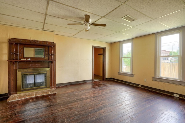 514 S Columbus St, Lancaster, OH 43130 - unfurnished living room with a paneled ceiling, wood-type flooring, a ceiling fan, and a glass covered fireplace