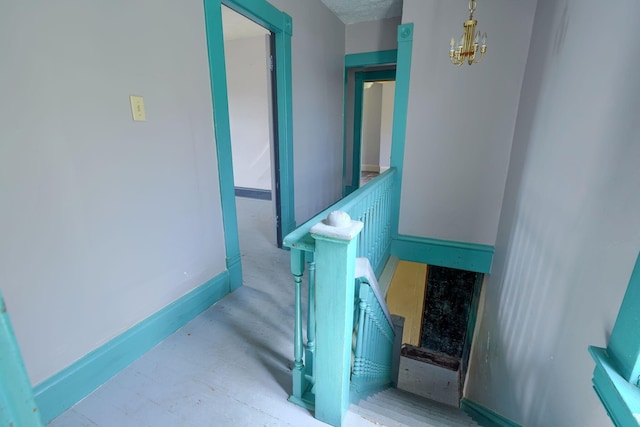 514 S Columbus St, Lancaster, OH 43130 - staircase with a chandelier and baseboards
