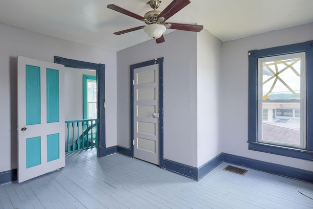 514 S Columbus St, Lancaster, OH 43130 - empty room with light wood-style floors and ceiling fan