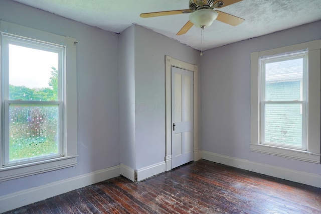 514 S Columbus St, Lancaster, OH 43130 - empty room featuring dark wood finished floors, plenty of natural light, and ceiling fan
