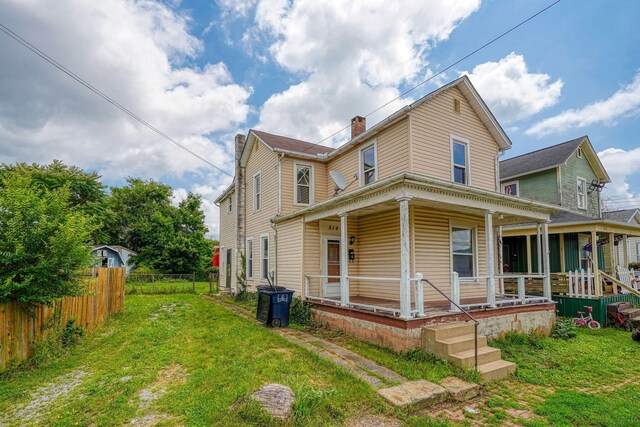 514 S Columbus St, Lancaster, OH 43130 - view of front of property featuring covered porch and a chimney