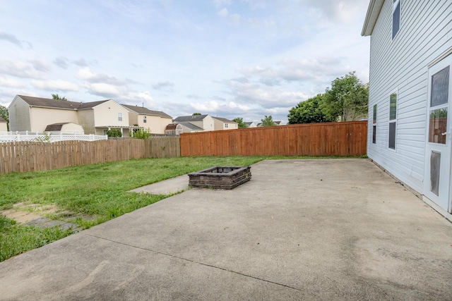 5480 Rothermund Dr, Canal Winchester, OH 43110 - fenced backyard featuring a patio area, a residential view, and an outdoor fire pit