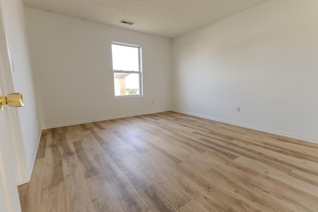 5480 Rothermund Dr, Canal Winchester, OH 43110 - spare room with light wood-type flooring and a textured ceiling