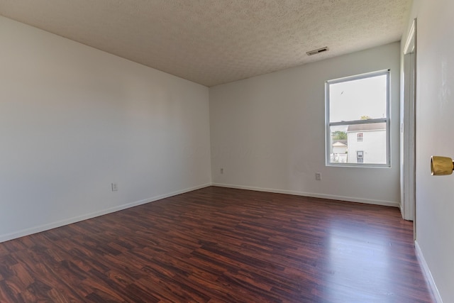 5480 Rothermund Dr, Canal Winchester, OH 43110 - empty room featuring dark wood-style flooring and a textured ceiling