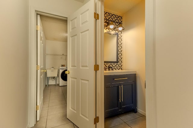5480 Rothermund Dr, Canal Winchester, OH 43110 - hall with washer / clothes dryer and light tile patterned floors