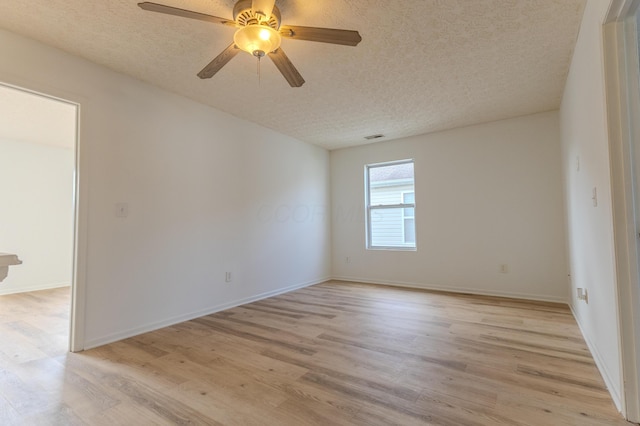 5480 Rothermund Dr, Canal Winchester, OH 43110 - unfurnished room featuring light wood-style flooring, a textured ceiling, and ceiling fan