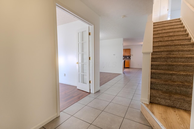 5480 Rothermund Dr, Canal Winchester, OH 43110 - staircase featuring tile patterned floors and baseboards