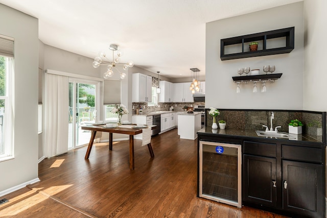 7774 Kingman Pl, Lewis Center, OH 43035 - kitchen featuring wine cooler, stainless steel appliances, plenty of natural light, and tasteful backsplash