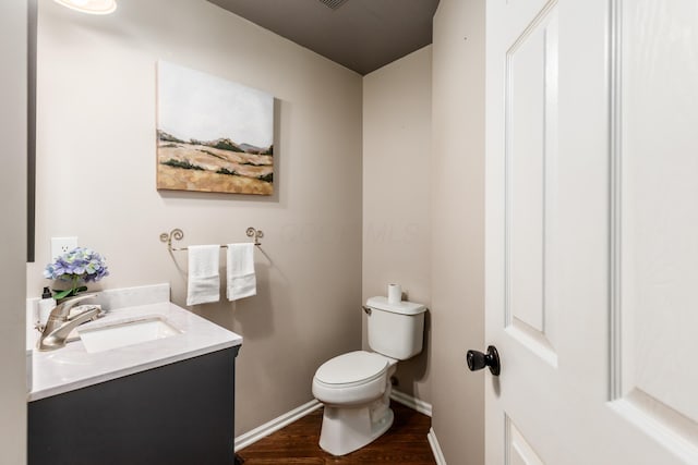 7774 Kingman Pl, Lewis Center, OH 43035 - half bathroom with vanity and wood finished floors