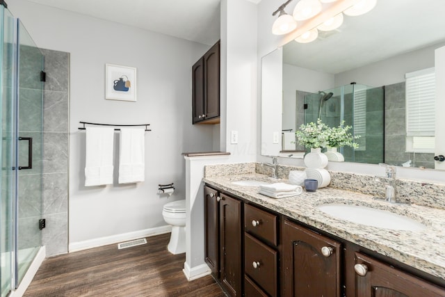 7774 Kingman Pl, Lewis Center, OH 43035 - bathroom with double vanity, a stall shower, and wood finished floors